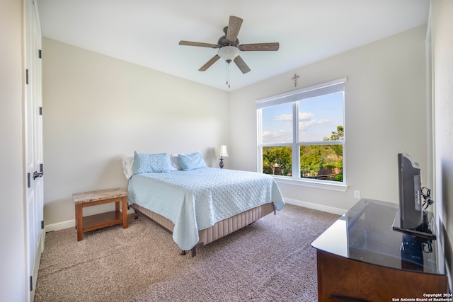 carpeted bedroom with ceiling fan