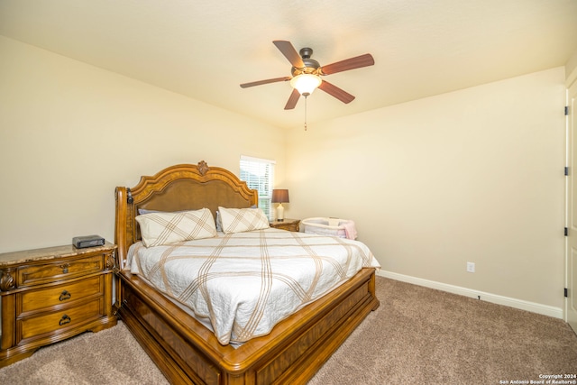 bedroom with ceiling fan and carpet flooring