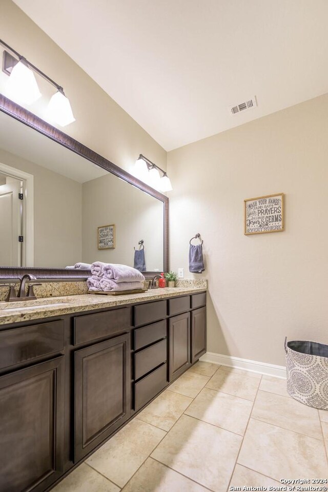 bedroom with multiple windows, a raised ceiling, and ceiling fan