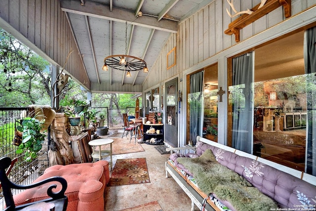 sunroom / solarium with lofted ceiling