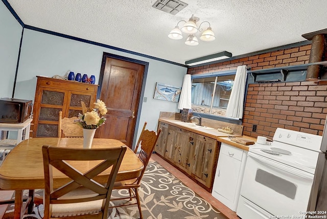 kitchen with crown molding, light countertops, visible vents, electric range, and a sink