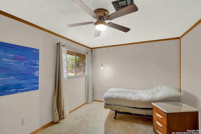 bedroom featuring a textured ceiling, ceiling fan, visible vents, baseboards, and crown molding