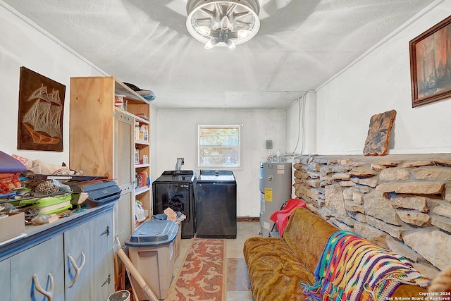 washroom with laundry area, water heater, and washing machine and clothes dryer