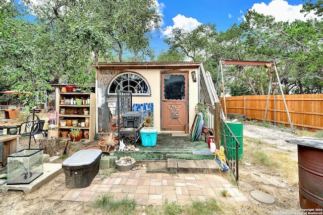 view of shed featuring fence