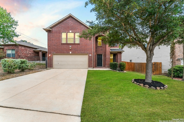 view of front of house with a garage and a front yard