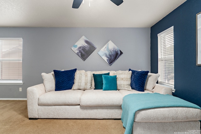 living room with carpet flooring and ceiling fan