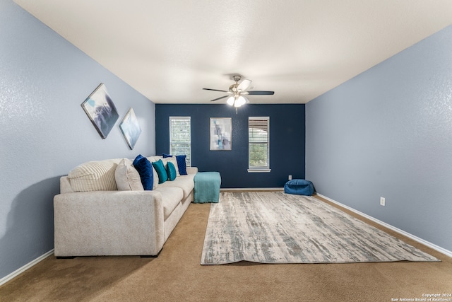 living room with ceiling fan and carpet floors