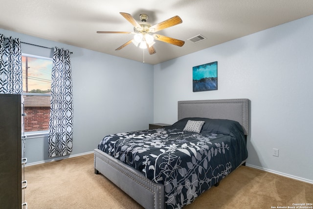 carpeted bedroom featuring ceiling fan