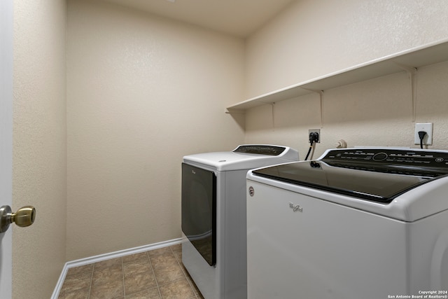 clothes washing area featuring washer and dryer