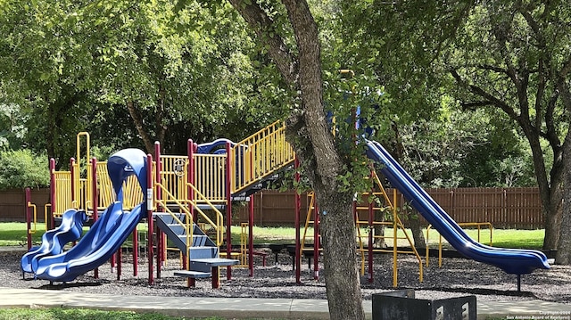 community jungle gym featuring fence