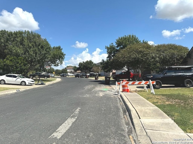 view of street featuring curbs and sidewalks