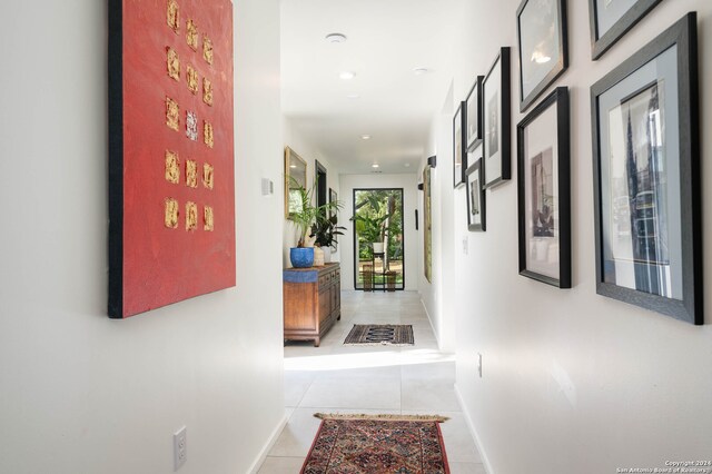 hallway featuring light tile patterned flooring