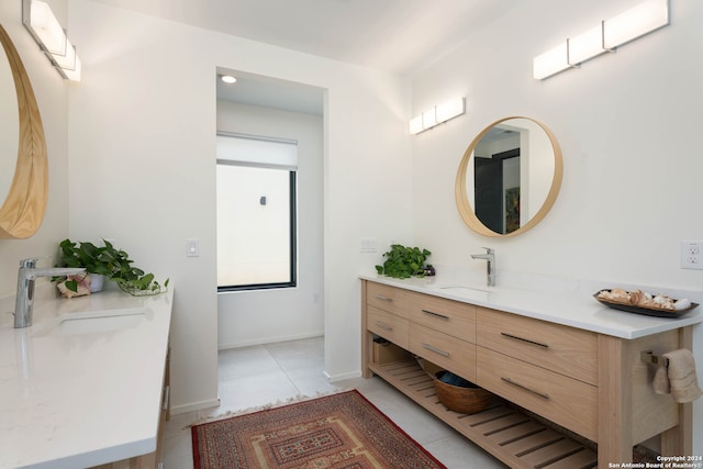 bathroom featuring tile patterned flooring and vanity