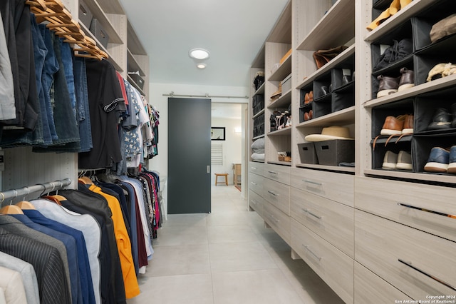 walk in closet featuring light tile patterned floors