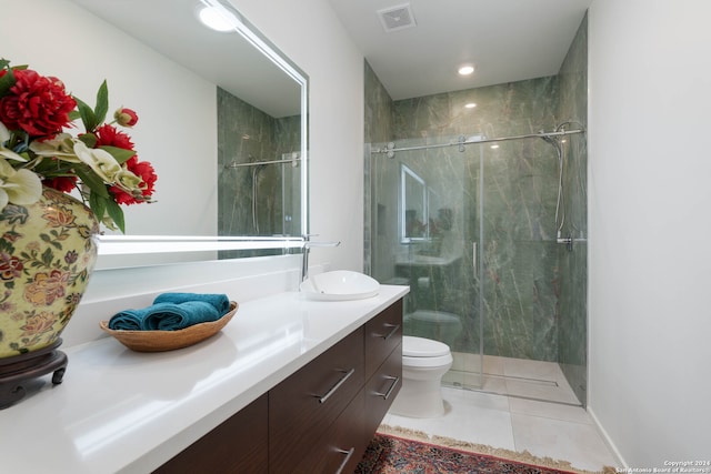 bathroom featuring an enclosed shower, tile patterned floors, toilet, and vanity