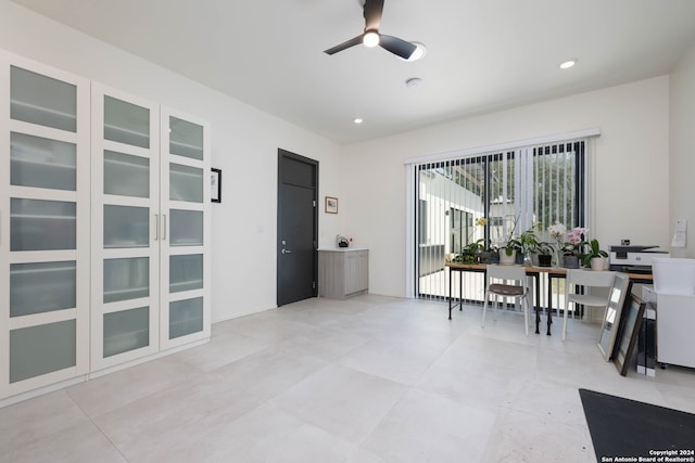 interior space featuring ceiling fan