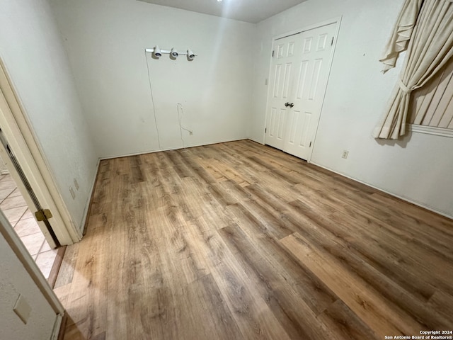 unfurnished room with light hardwood / wood-style flooring