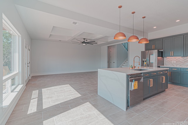 kitchen with black dishwasher, plenty of natural light, sink, and stainless steel fridge