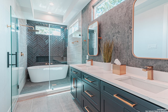 bathroom featuring tile patterned floors, separate shower and tub, and vanity