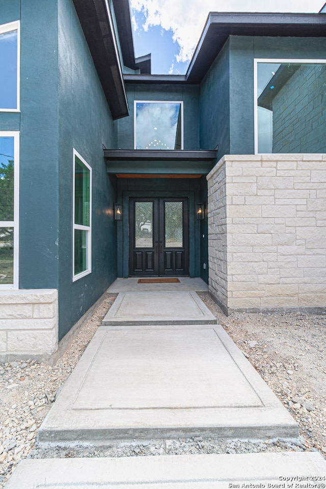 entrance to property featuring french doors