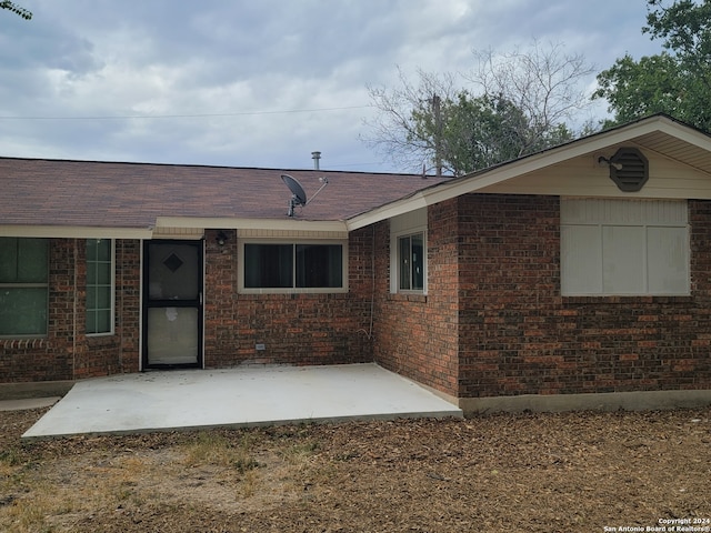 rear view of house featuring a patio