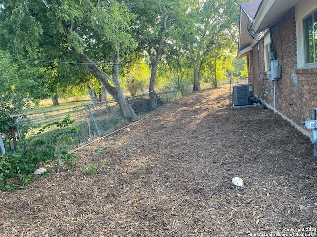 view of yard featuring central AC