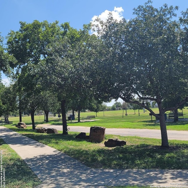 surrounding community featuring a lawn