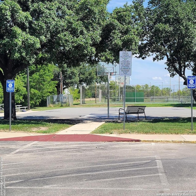 view of community featuring basketball hoop