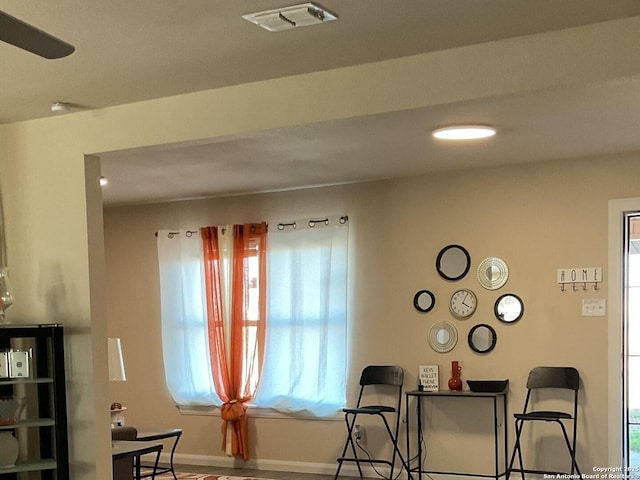 sitting room with baseboards and visible vents