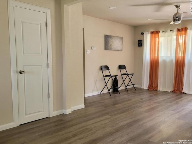 empty room featuring dark hardwood / wood-style floors and ceiling fan