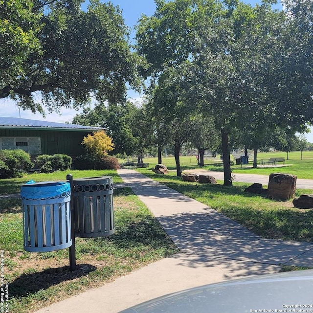 view of home's community featuring a lawn