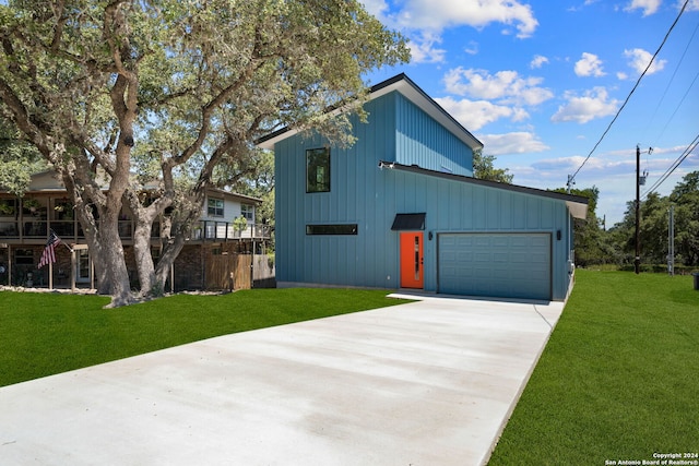 view of front facade with a front yard and a garage