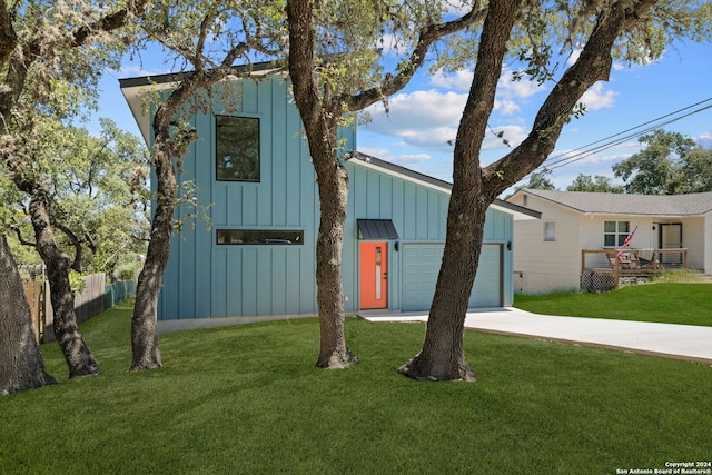 view of front facade with a front yard and a garage