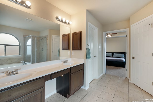 bathroom featuring tile patterned floors, independent shower and bath, ceiling fan, and vanity