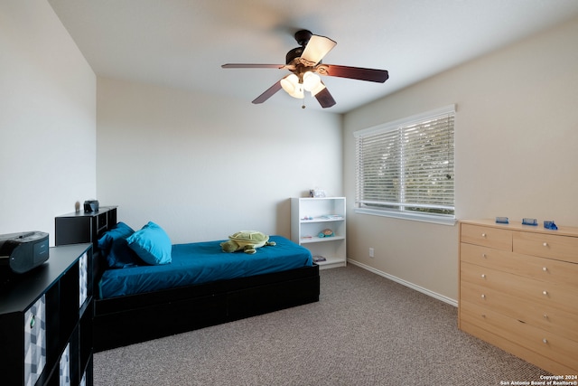 bedroom with ceiling fan and carpet