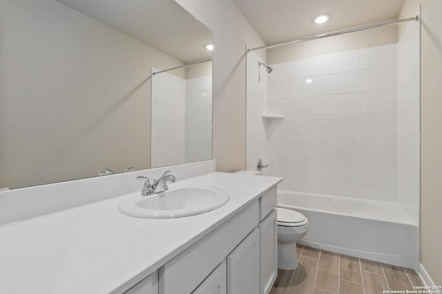 full bathroom with recessed lighting, toilet, washtub / shower combination, wood tiled floor, and vanity