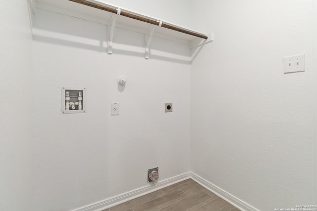 washroom featuring laundry area, baseboards, hookup for a washing machine, wood finish floors, and electric dryer hookup