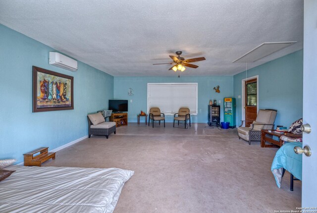 bedroom with a wall mounted AC, ceiling fan, and a textured ceiling