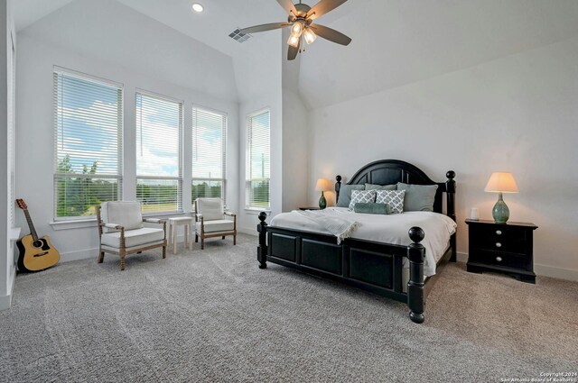 bedroom featuring light colored carpet, ceiling fan, and high vaulted ceiling