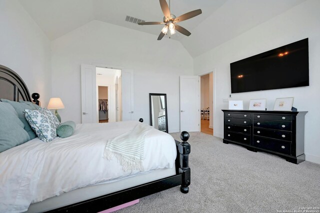 carpeted bedroom featuring lofted ceiling and ceiling fan