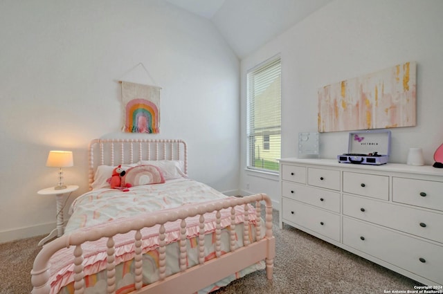 bedroom featuring light colored carpet, vaulted ceiling, and baseboards