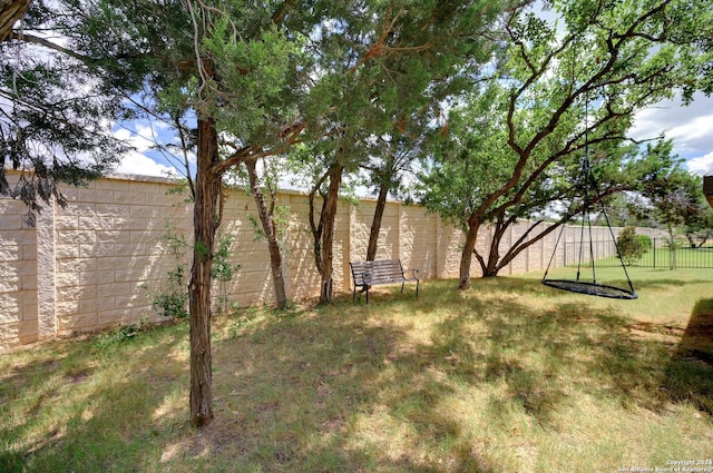 view of yard with a fenced backyard