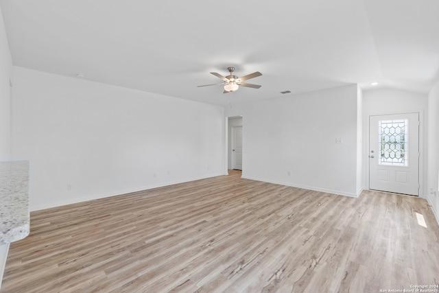 unfurnished living room with lofted ceiling, light hardwood / wood-style flooring, and ceiling fan