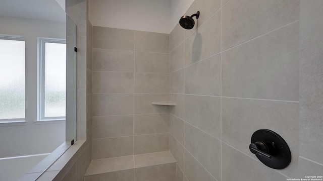 bathroom featuring tiled shower