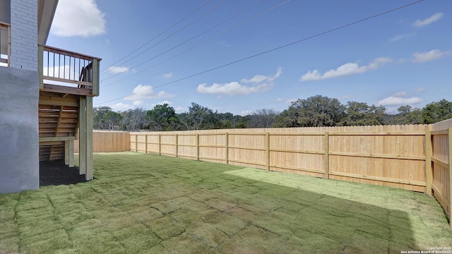 view of yard with a fenced backyard