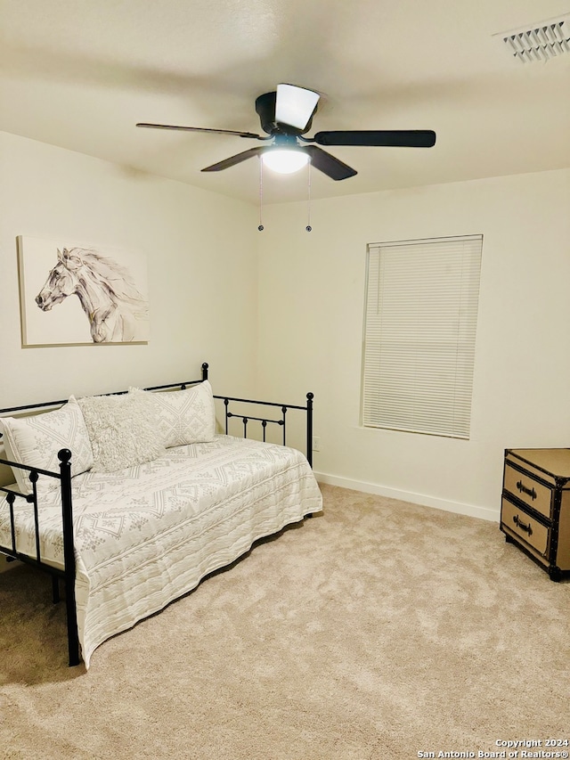 carpeted bedroom featuring ceiling fan