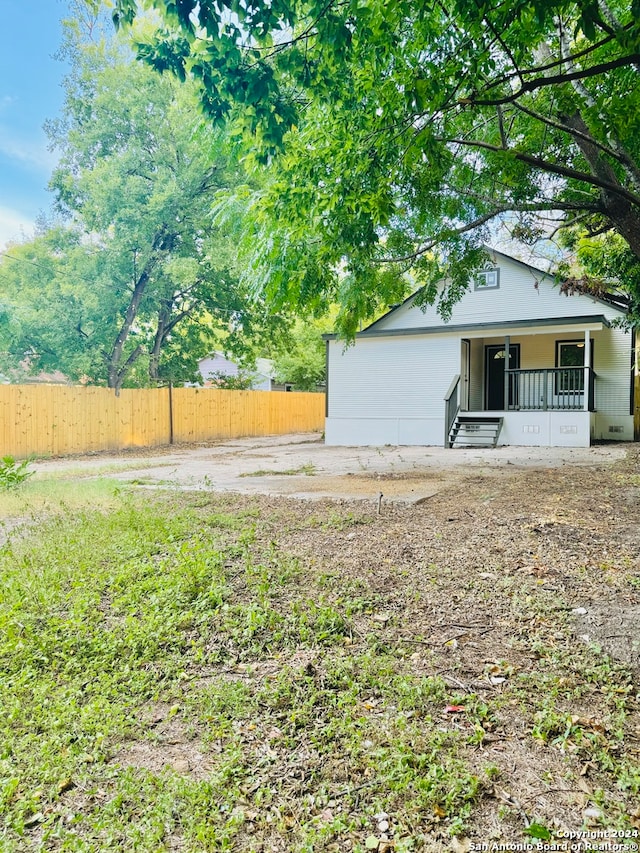 view of yard with covered porch