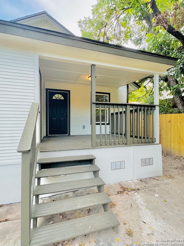 entrance to property with a porch