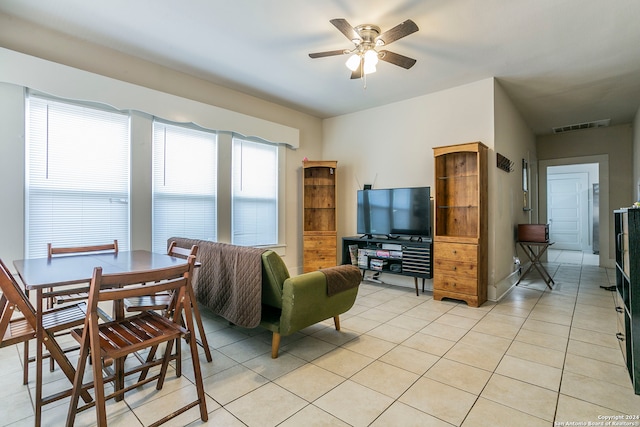 living room with ceiling fan and light tile patterned floors