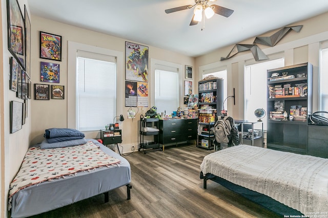 bedroom featuring dark hardwood / wood-style flooring and ceiling fan